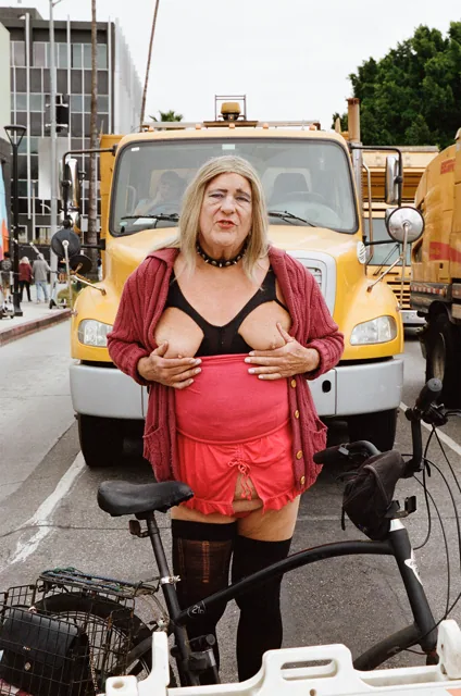 Street portrait with bicycle and yellow truck