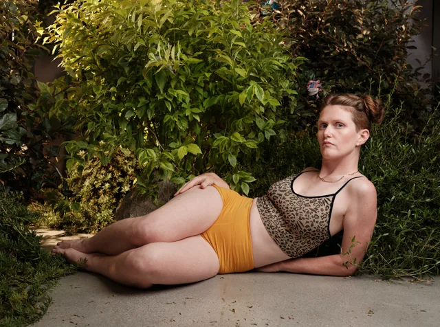 Jules lying in a leopard top